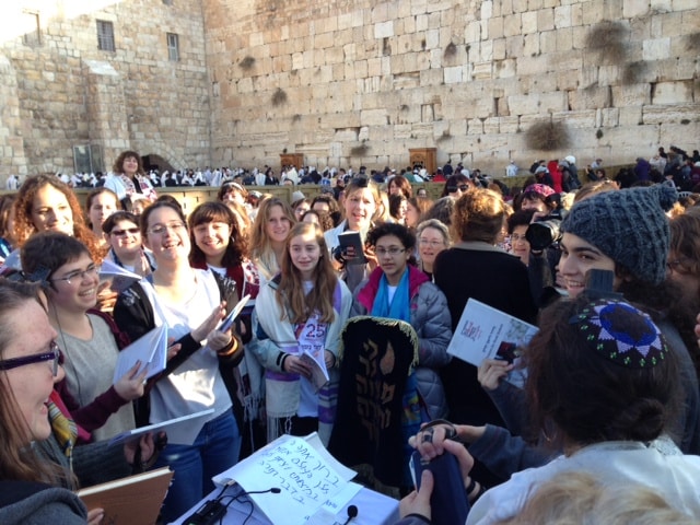 Alexandra Schwartz holds an empty Torah cover because the authorities prevented Women of the Wall from brining one in. To the left of Alexandra are Lucy Sattler and Eliza Moss-Horwitz.
